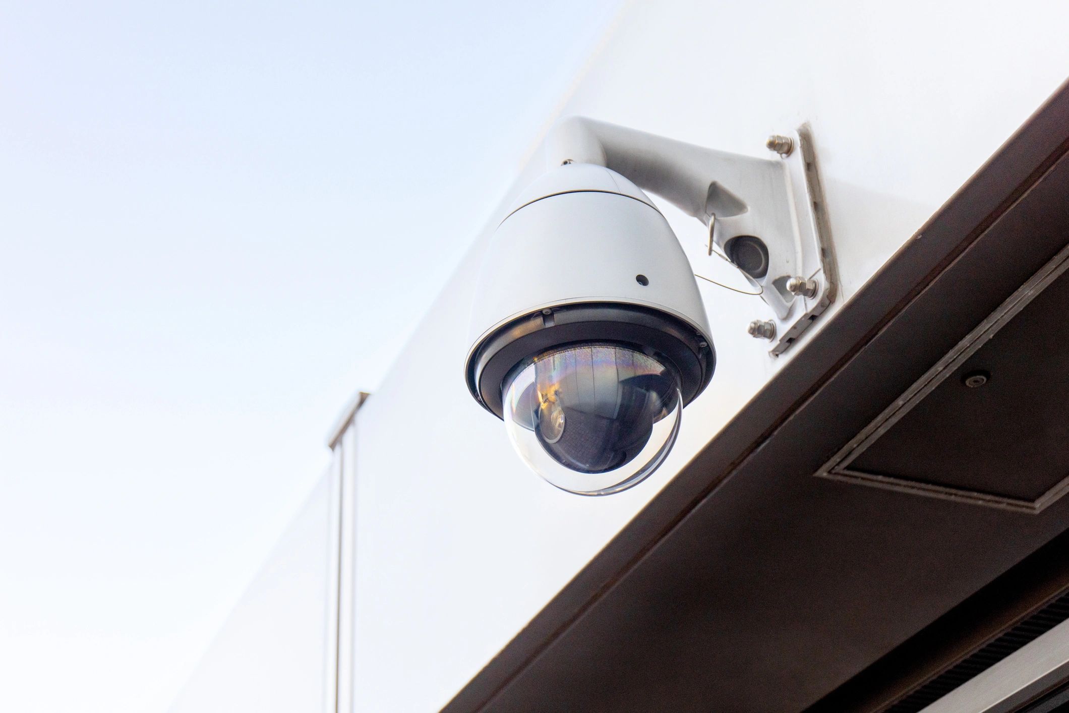 Outdoor surveillance camera on commercial building