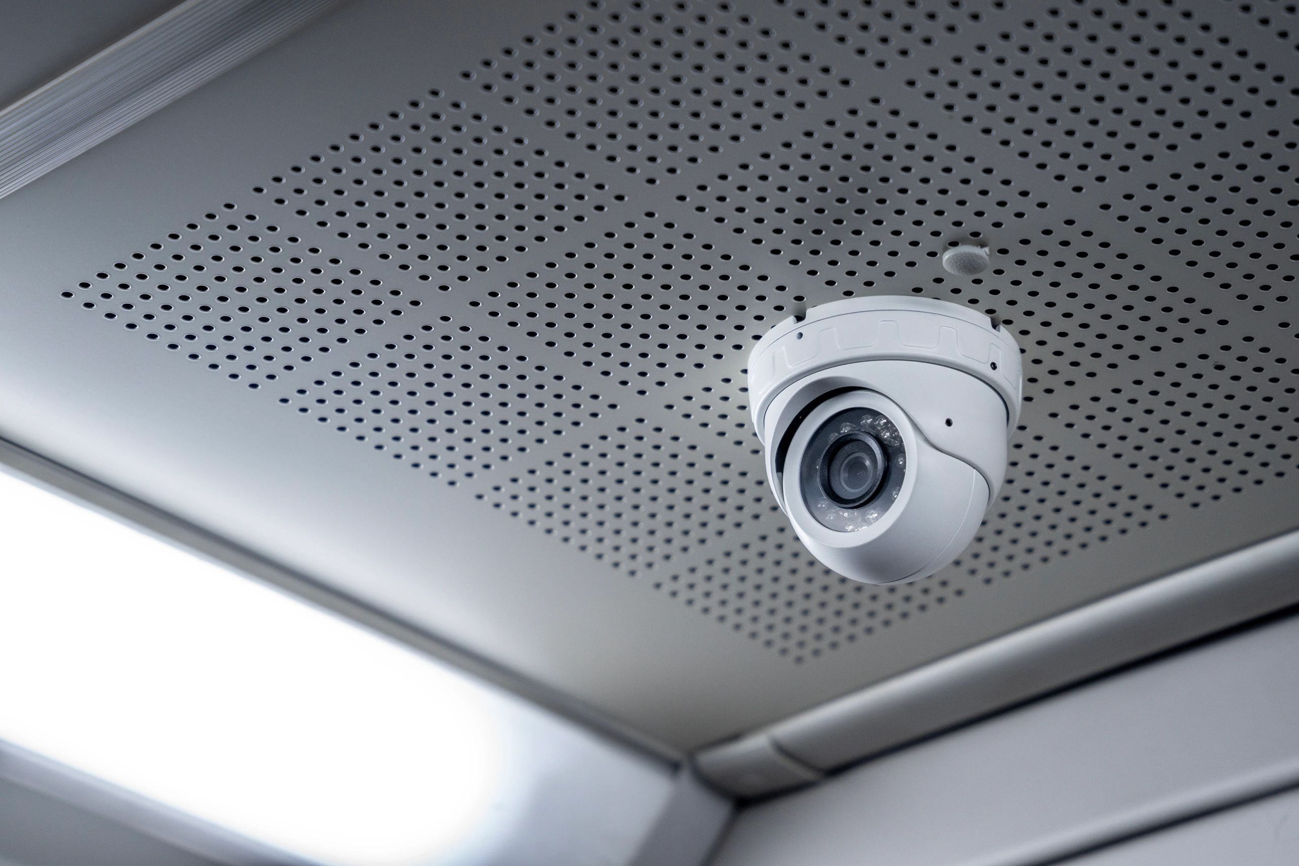 Technician installing a security camera